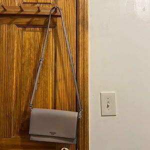 Kate Spade Purse, two straps,two tiny stains inside the purse,outside is perfect